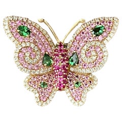 Bague papillon en or rose 18 carats, rubis, diamants, saphirs roses et tsavorites
