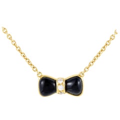 Van Cleef & Arpels Onyx Diamond Gold Bow Pendant Necklace