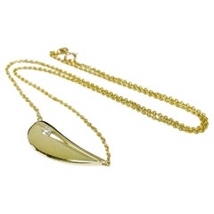 Collana a forma organica con accenti di diamanti in oro giallo