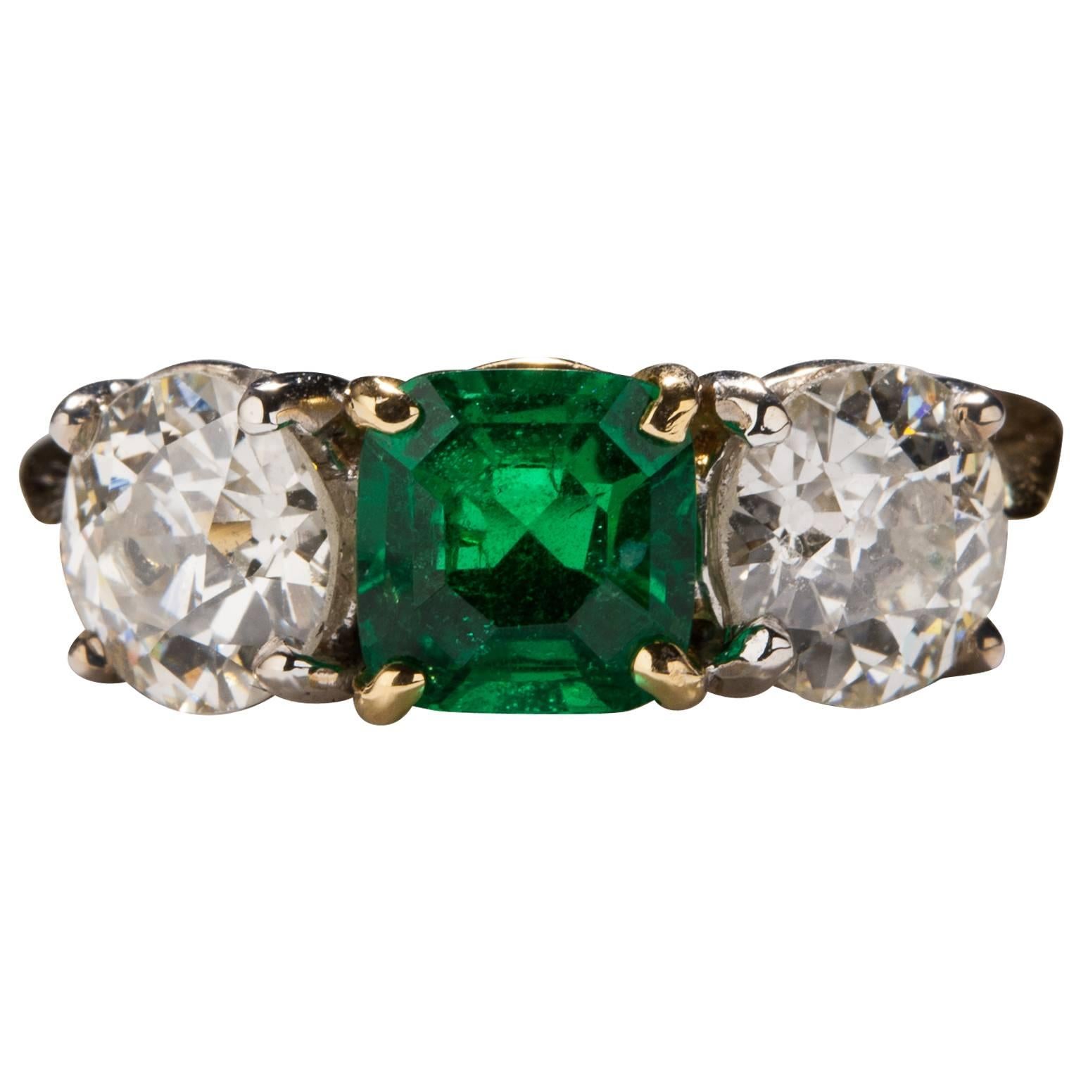 1.09 Carat Emerald Diamond Gold Three Stone Ring For Sale