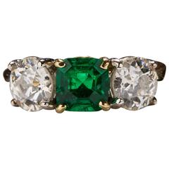 1.09 Carat Emerald Diamond Gold Three Stone Ring