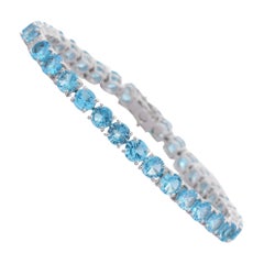 Bracelet tennis en or blanc massif 18 carats avec topaze bleue scintillante et diamants