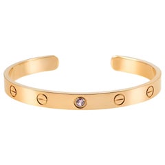 Cartier Bracelet jonc Love en or rose avec saphir, taille 17