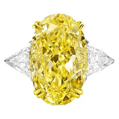 GIA Certified 6.90 Carat Fancy Intense Yellow Oval Diamond Solitaire Ring