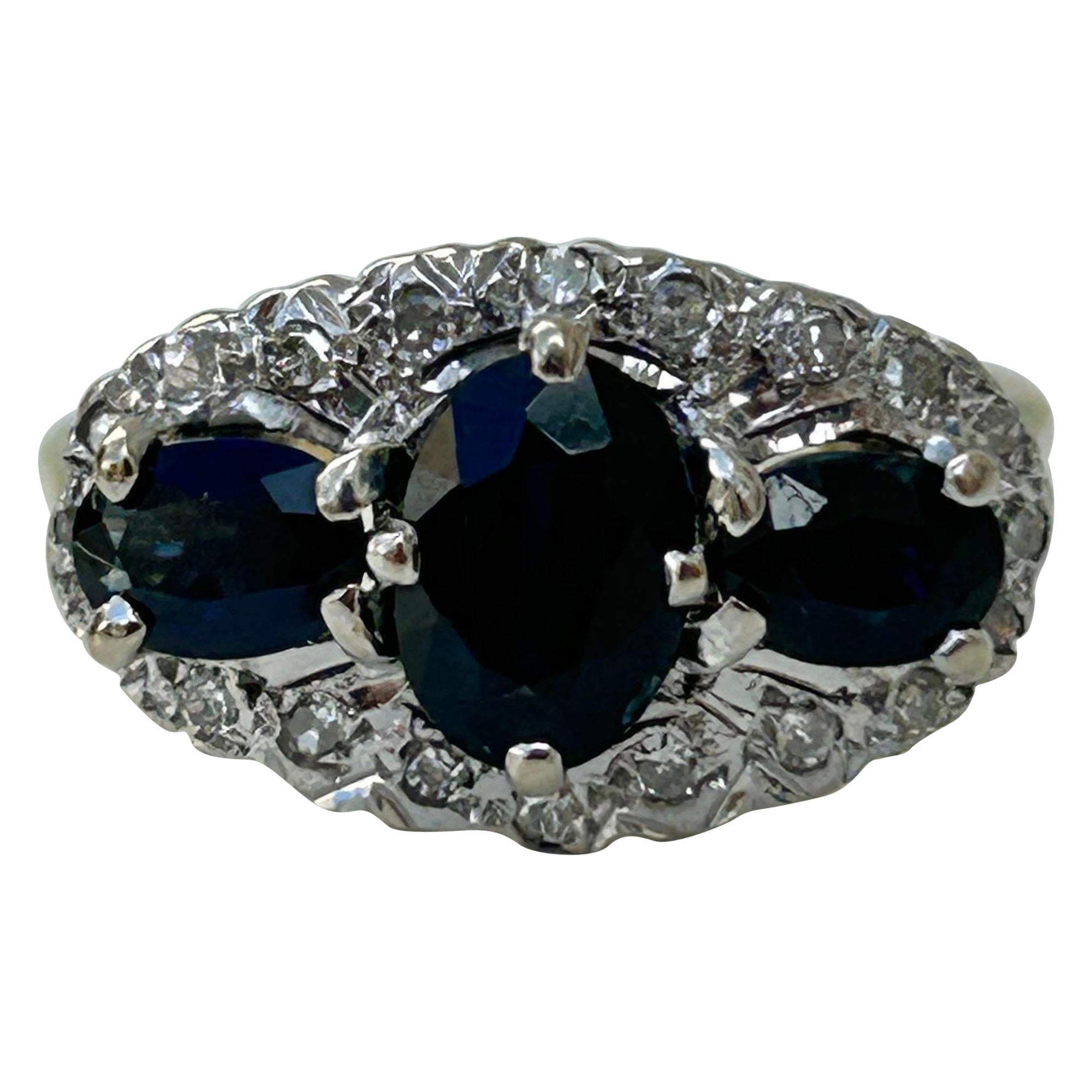 Vintage 18 Carat Yellow Gold Sapphire and Diamond Triple Halo Ring For Sale