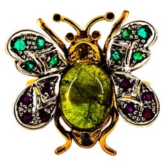 Bague cocktail en or jaune avec diamant blanc, émeraude, saphir, rubis et tourmaline verte