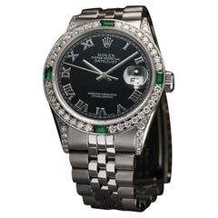 Rolex Montre Datejust en acier inoxydable avec cadran romain noir et lunette en diamants et émeraudes, 36 mm