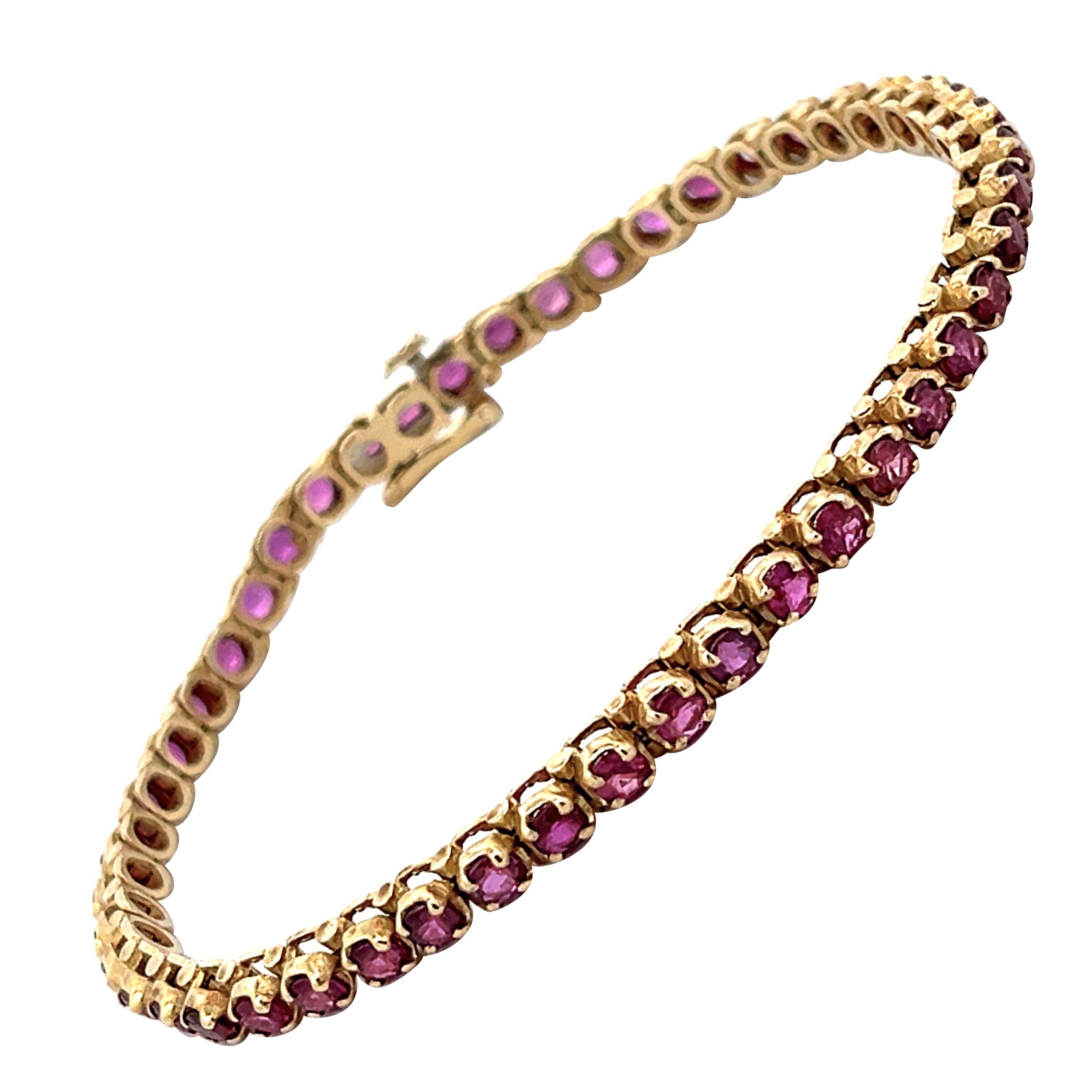 Round Red Ruby Tennis Bracelet in 14k Yellow Gold For Sale