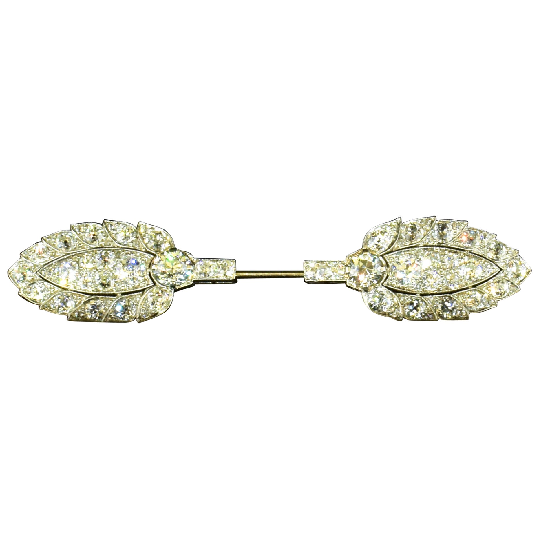 Cartier Edwardian Antique diamond and platinum jabot or Cliquet Pin, c. 1914.  Whether we call it late Edwardian or early Art Deco, the cliquet pin was a specialized brooch where only the two visible decorative elements are seen; the platinum bar is