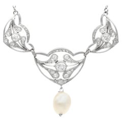 Ciondolo antico in platino con perla naturale e diamante da 1,43 carati in stile Art Nouveau
