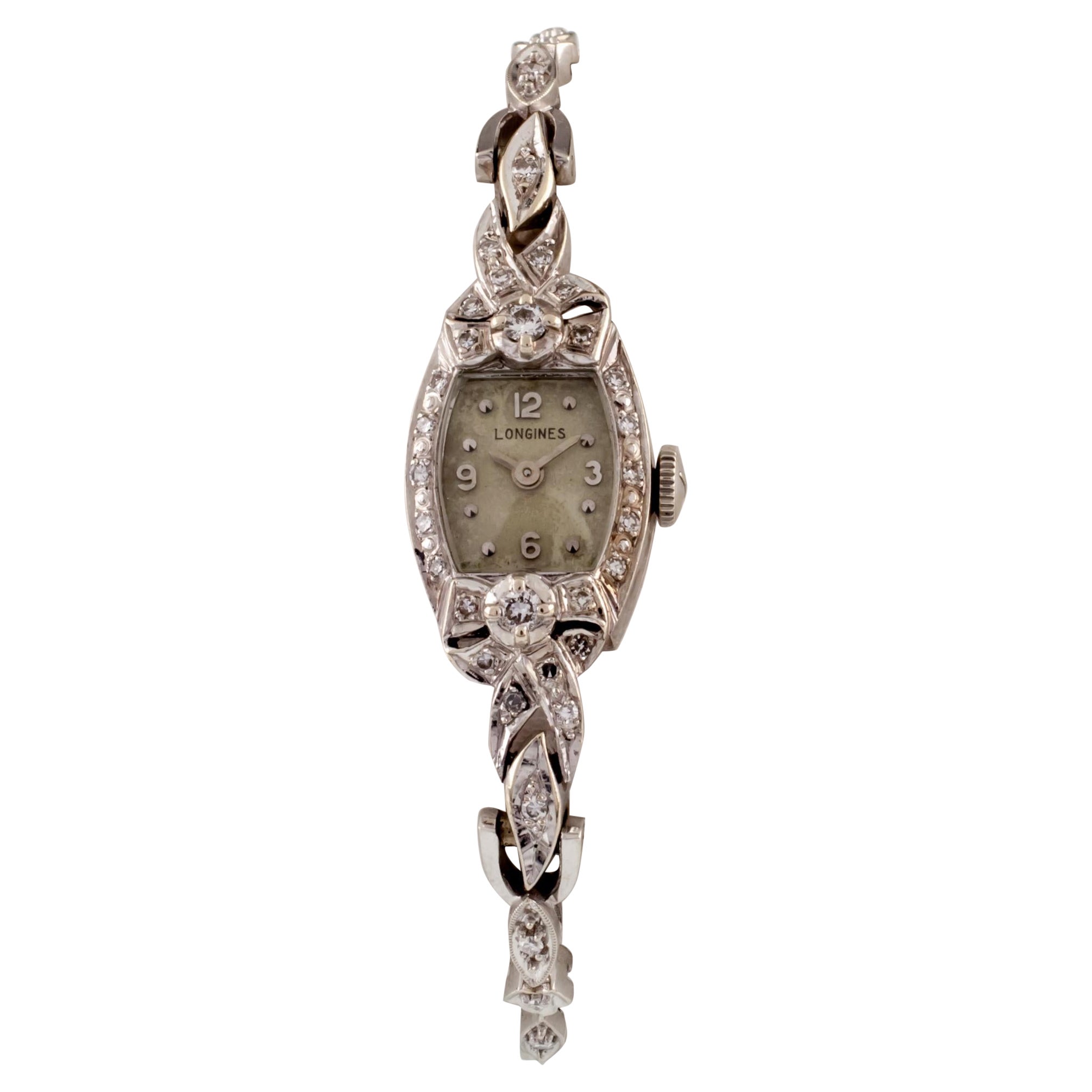Magnifique montre habillée Longines en or blanc 14 carats et diamants pour femme en vente