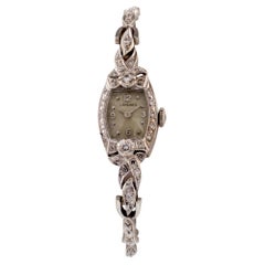 Magnifique montre habillée Longines en or blanc 14 carats et diamants pour femme