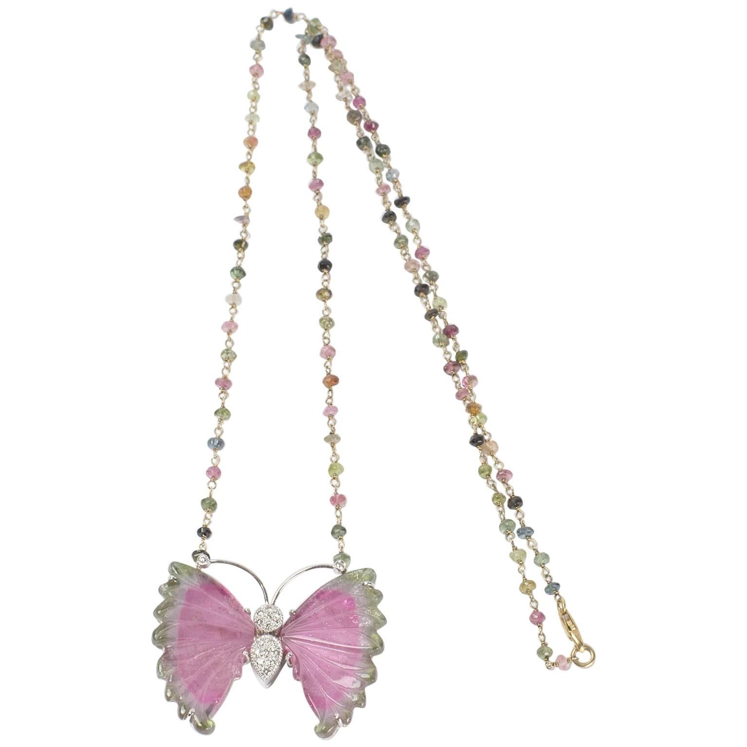 Multi-colored facet-cut Tourmaline rondelles hand-linked gilt S/S chain suspending a fabulous Butterfly with hand carved green and pink Tourmaline wings and pave set Diamond body. Beautifully hand crafted in 14k gold. This Chic necklace, Fabulous as