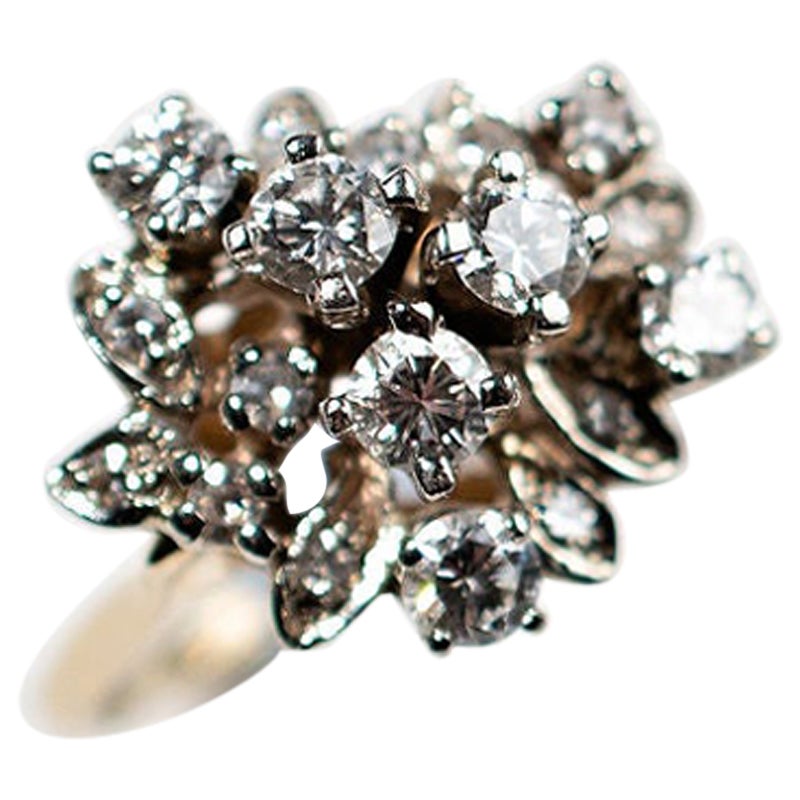 Diamond Cluster Ring set in 14k yellow gold is the perfect statement ring or engagement ring. It is old school glamour and yet looks fantastic worn with modern jewelry. The cluster look gives the feel that the diamond are larger. The setting is so