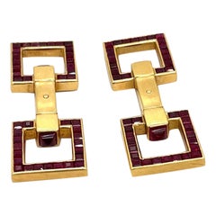 Cartier Boutons de manchette étriers vintage en or jaune 18 carats et rubis