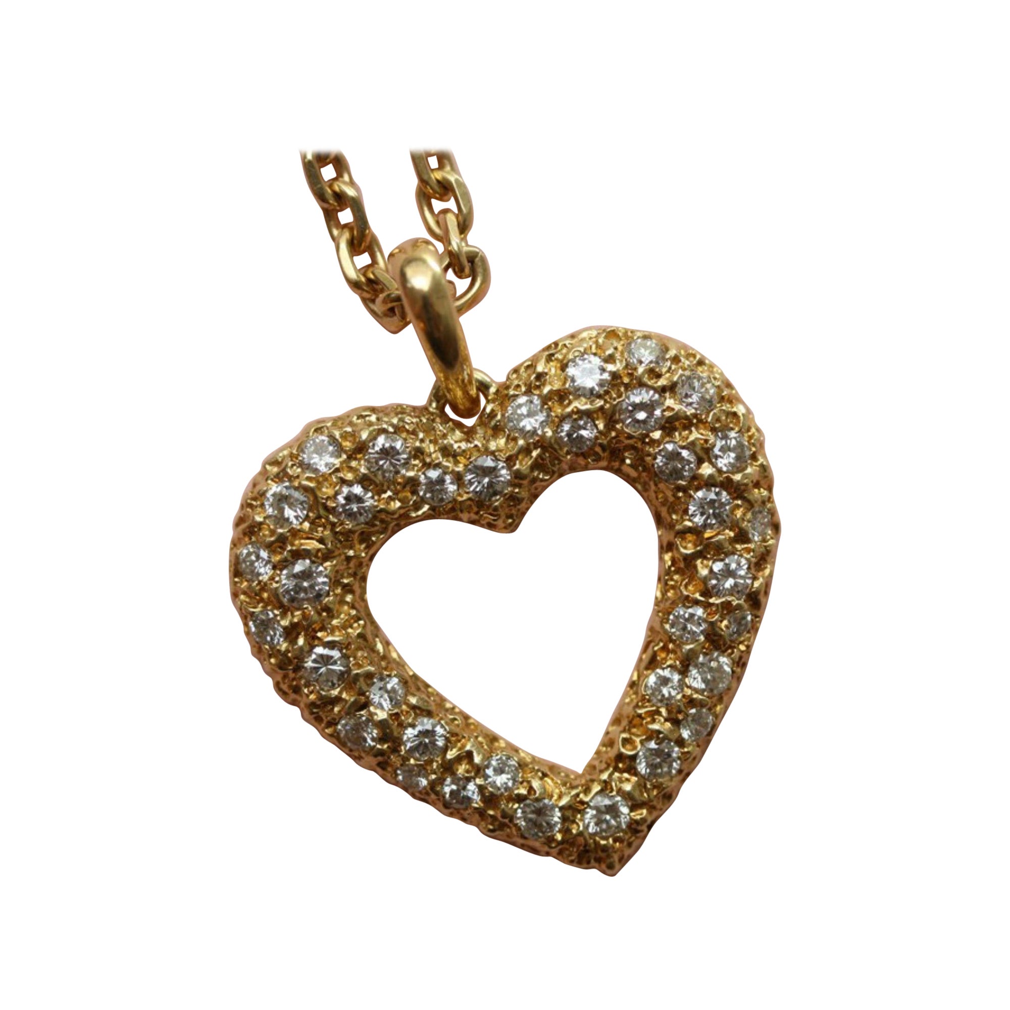 Ciondolo a forma di cuore in oro e diamanti