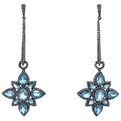 Boucles d'oreilles Paradizia en topaze bleue suisse pavée de diamants