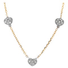 Collier en or jaune blanc avec pendentif en forme de coeur à trois diamants