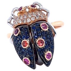 18 K Roségold Ladybug-Ring mit braunen Diamanten und blauen Saphiren