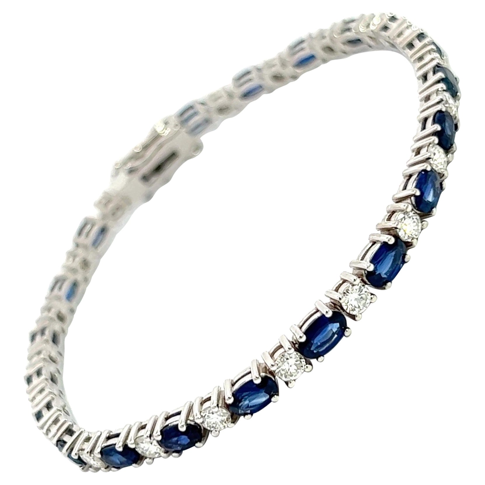 Natural Blue Oval Sapphires & Diamonds Bracelet, 14k White Gold, Excellent Value.
You can call it Tennis Bracelet or Fashion Bracelet, the important thing is that you can wear it all the time. Top Quality, Gorgeous Brilliant Color.
Natural Brilliant