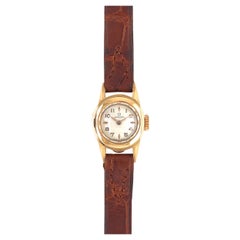 Omega Montre vintage pour femmes avec cadran blanc cassé et boîtier en or jaune 18 carats