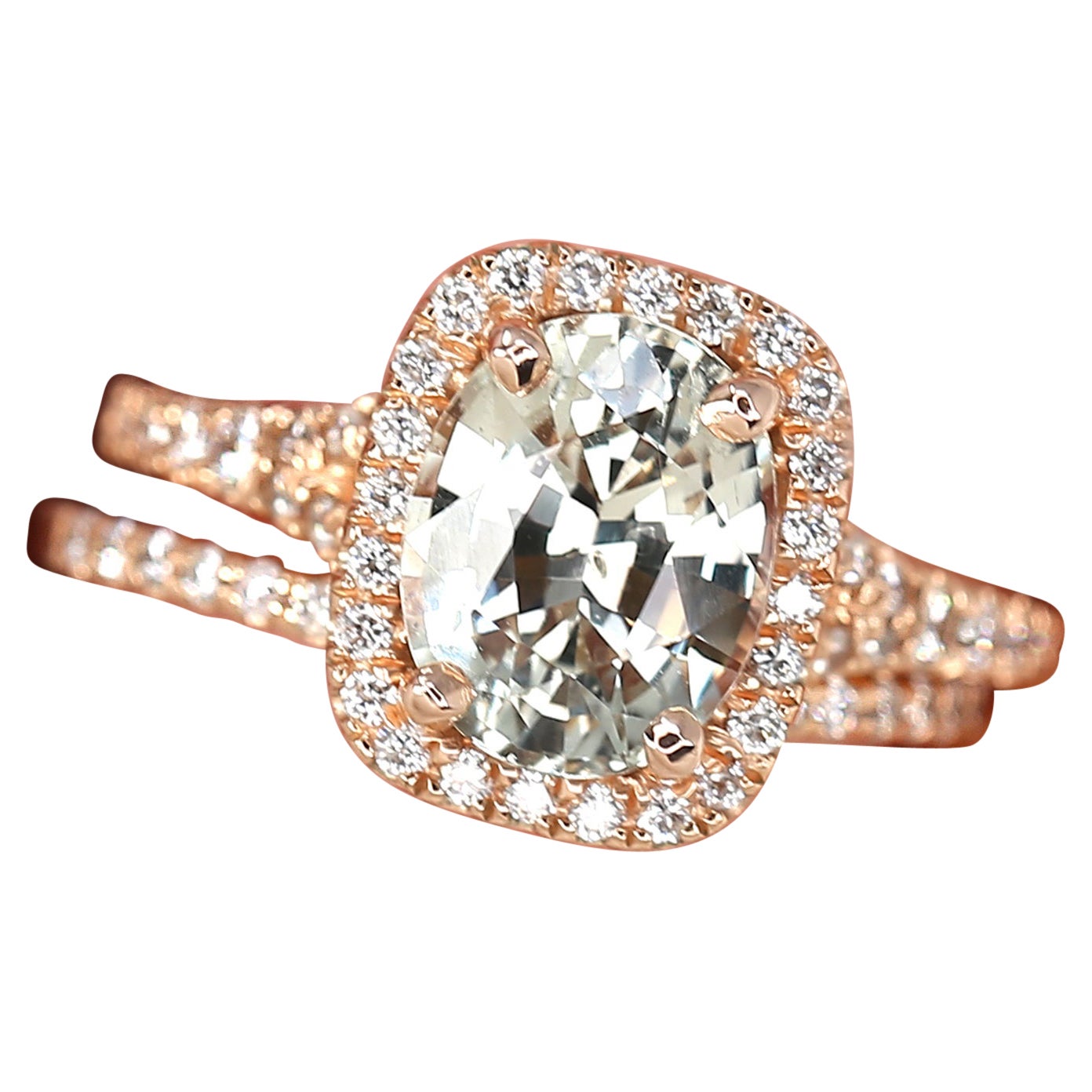 Discover our enchanting peach champagne sapphire halo ring with a mermaid split shank design. Featuring an ethically sourced sapphire, this unique ring is adorned with dainty pave fair trade diamonds that is handcrafted by expert artisans from