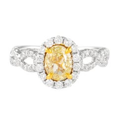 Alexander, bague en or 18 carats avec diamants ovales jaunes intenses de 1,56 carat et halo