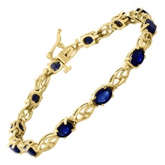 8Ct Natural Oval Blue Sapphire Tennis Bracelet 14 Karat Yellow Gold, 7 Inch Long