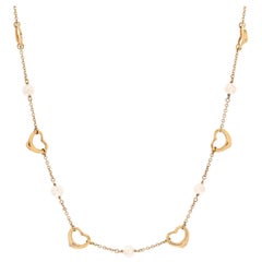 Tiffany & Co. Elsa Peretti Collier station en or jaune 18 carats et perles en forme de cœur ouvert