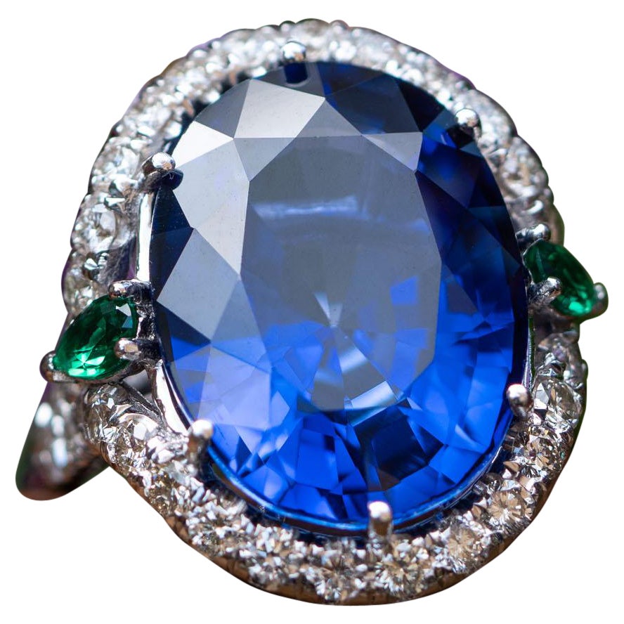 25.00 Ct Oval Sapphire Ring, 0.30 Natural Emeralds, 1.10 Carat Natural Diamonds For Sale