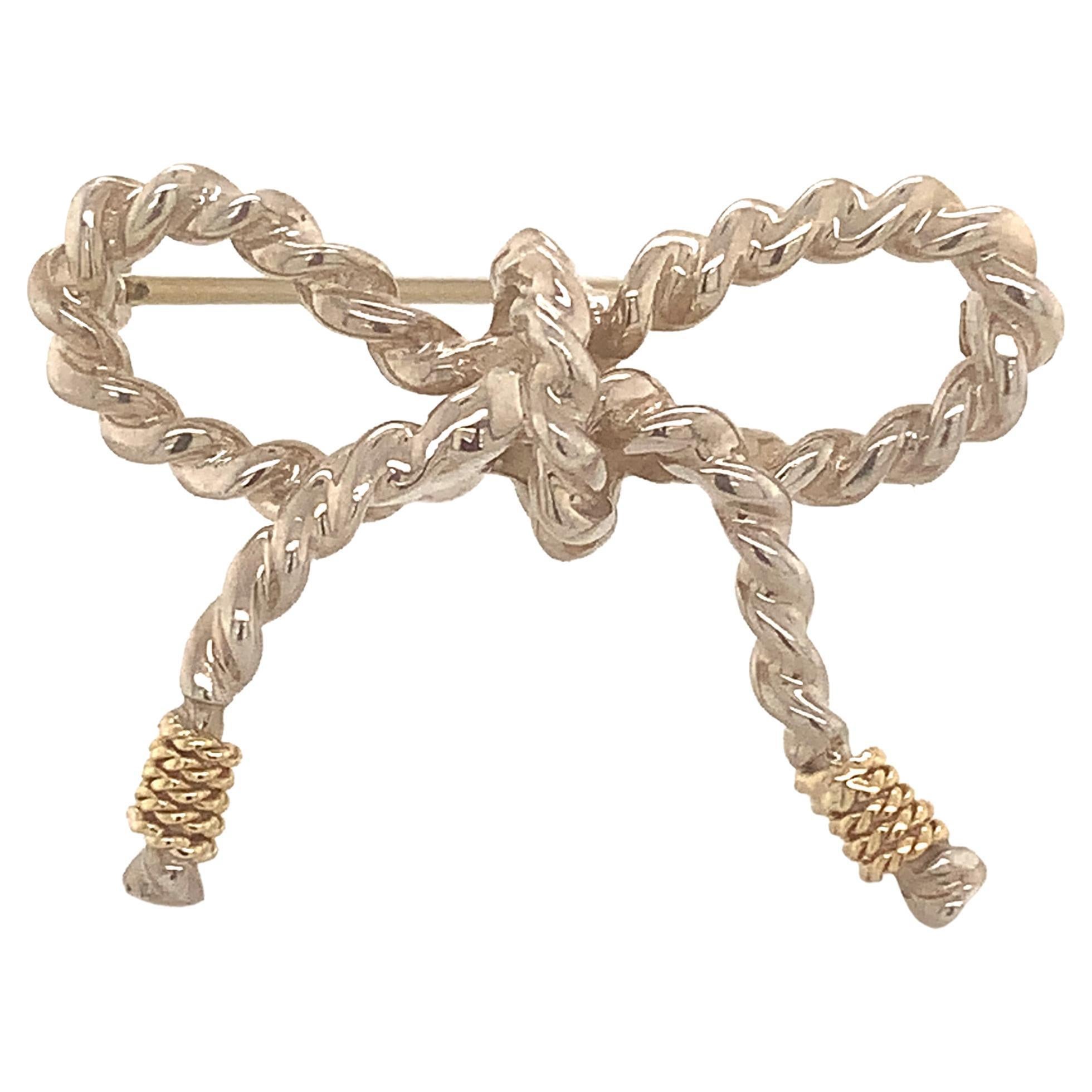 Tiffany & Co Broche en forme de nœud papillon en or 18 carats et argent sterling en vente