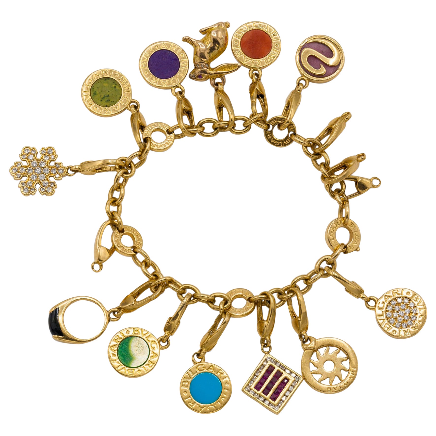 18CT GOLD CHARM BRACELET Jewellery  Gemstones  Bracelets  Auctionet