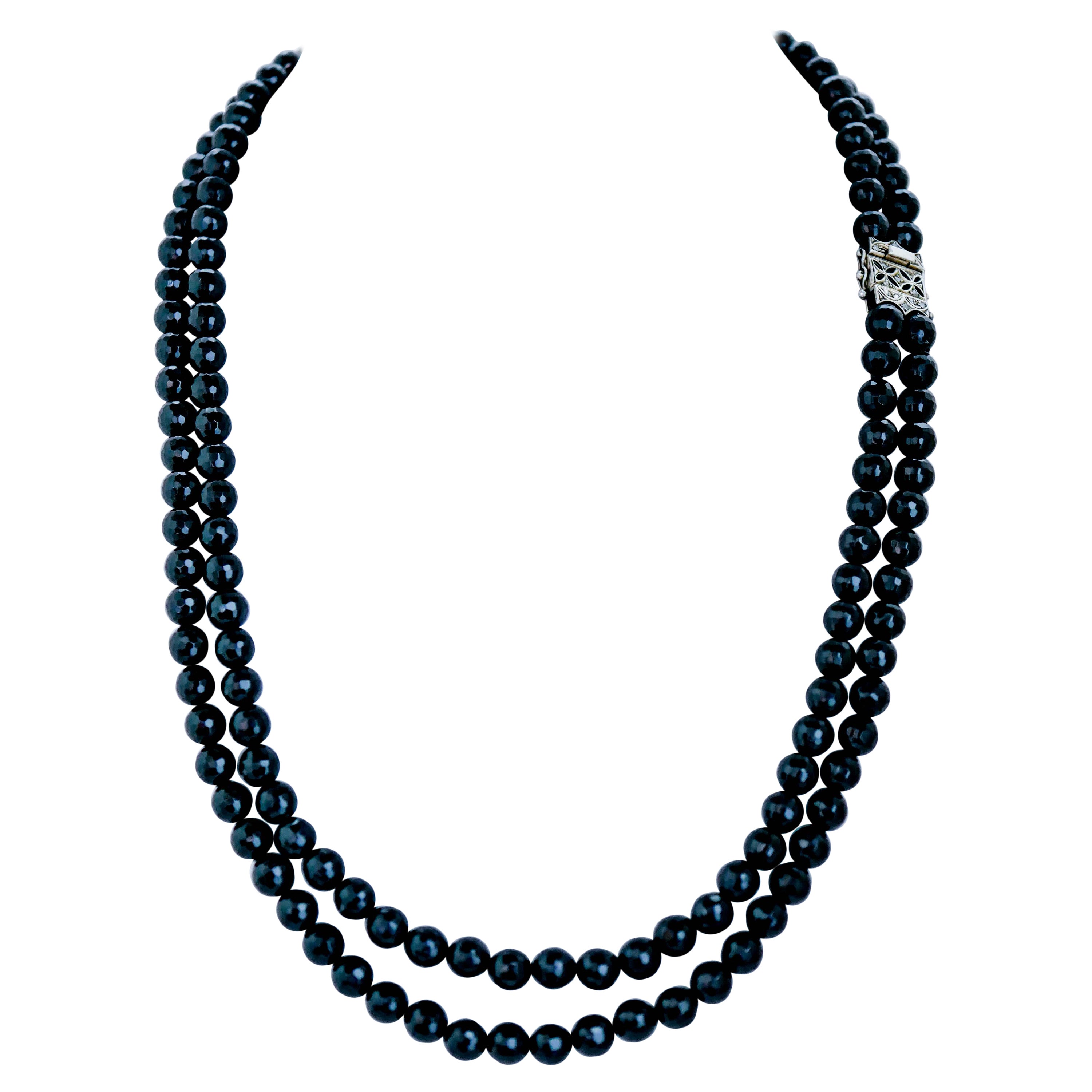 Mehrreihige Halskette aus Onyx, Diamanten, Roségold und Silber.