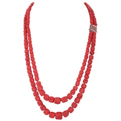 Collier en corail, diamants, or rose et argent.