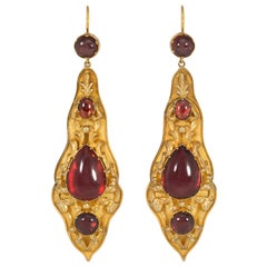 Antique Gold and Cabochon Garnet Pendant Earrings with Repoussé Decoration