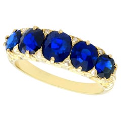 Antique 3.15 Carat Basaltic Sapphire and Diamond Five Stone Ring in Yellow Gold