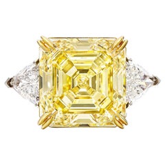 GIA Certified 12 Carat Emerald Cut Fancy Yellow Diamond Trillion side Ring 