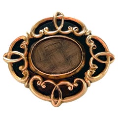 Broche de deuil ancienne en or 10ct 