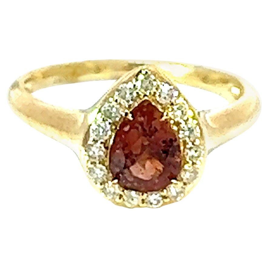 Rare Certified 14k Padparadscha .94 Crt with .22 crt Diamond Engagement Ring

Introducing the Rare Certified 14k Padparadscha Engagement Ring, a truly exceptional piece that showcases a rare and captivating .94 carat natural padparadscha sapphire