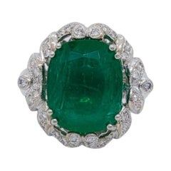 Ovaler Smaragd- und runder Diamantring aus 18 Karat Weißgold in Form von Smaragd