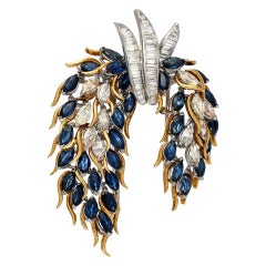 Broche Flex en platine et or avec saphir bleu et diamants