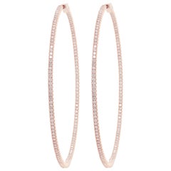 Diana M. 14kt rose gold, 1.75" hoop earrings featuring 1.30 cts round diamond
