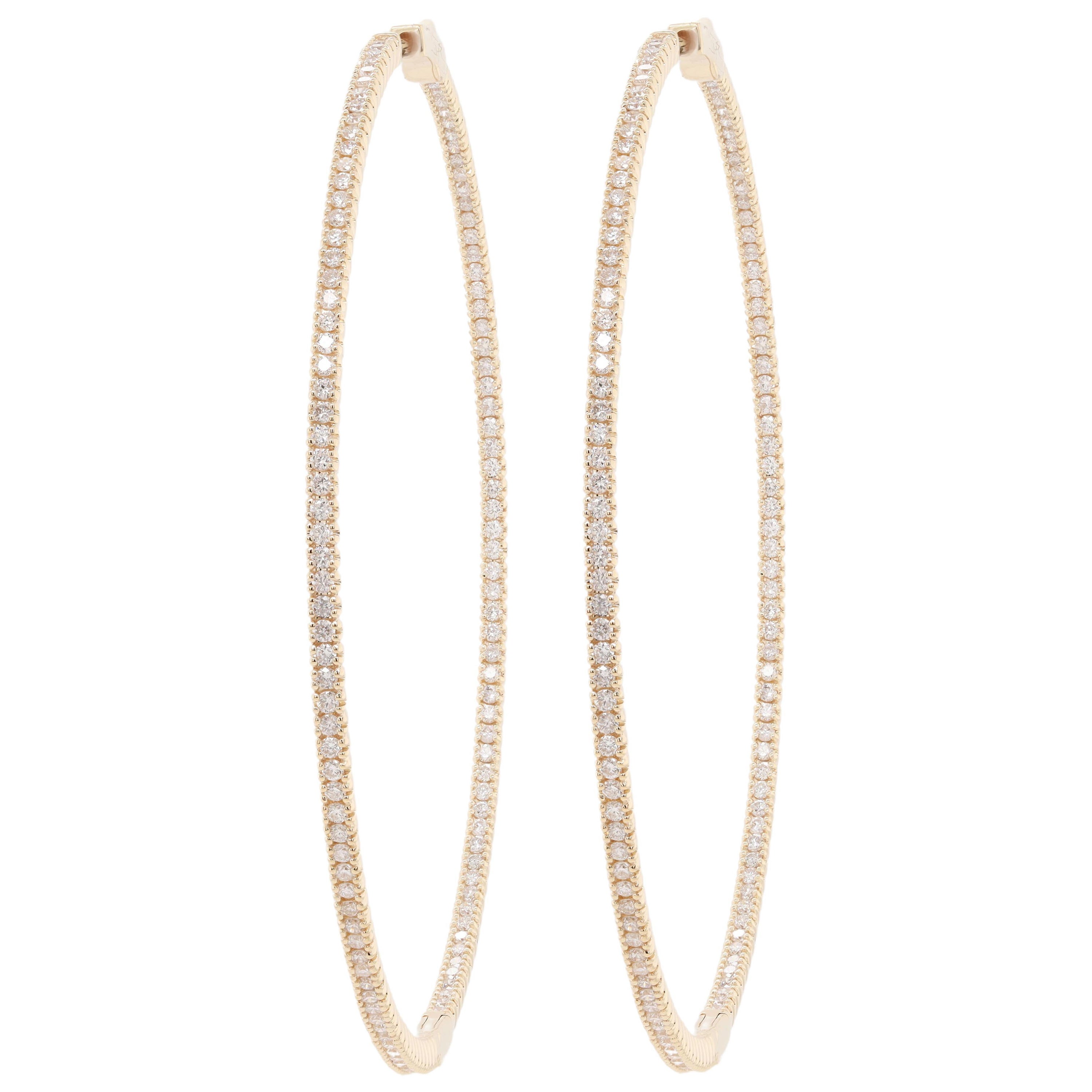 Diana M. 14kt yellow gold, 1.75" hoop earrings featuring 1.30cts round diamonds For Sale
