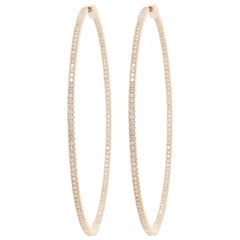 Diana M. 14kt yellow gold, 1.75" hoop earrings featuring 1.30cts round diamonds
