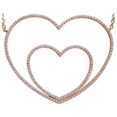 Diamants, collier pendentif cœur en or rose 18 carats.