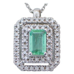 Emerald, Diamonds, 18 Karat White Gold Pendant Necklace.