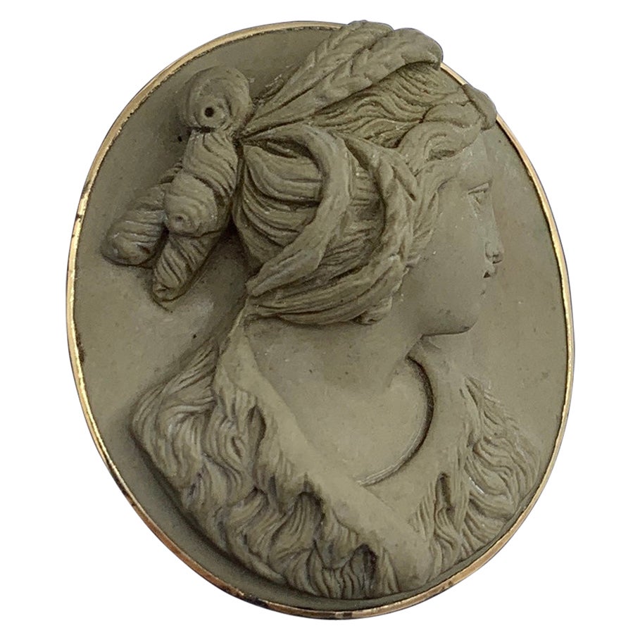 Indulge in a magnificent Antique Victorian Lava Cameo Brooch Pin of a Renaissance Revival Portrait Bust of the Roman Goddess of the Earth and Harvest Ceres.  This is a spectacular and very rare monumental antique Victorian Lava Cameo Brooch with a