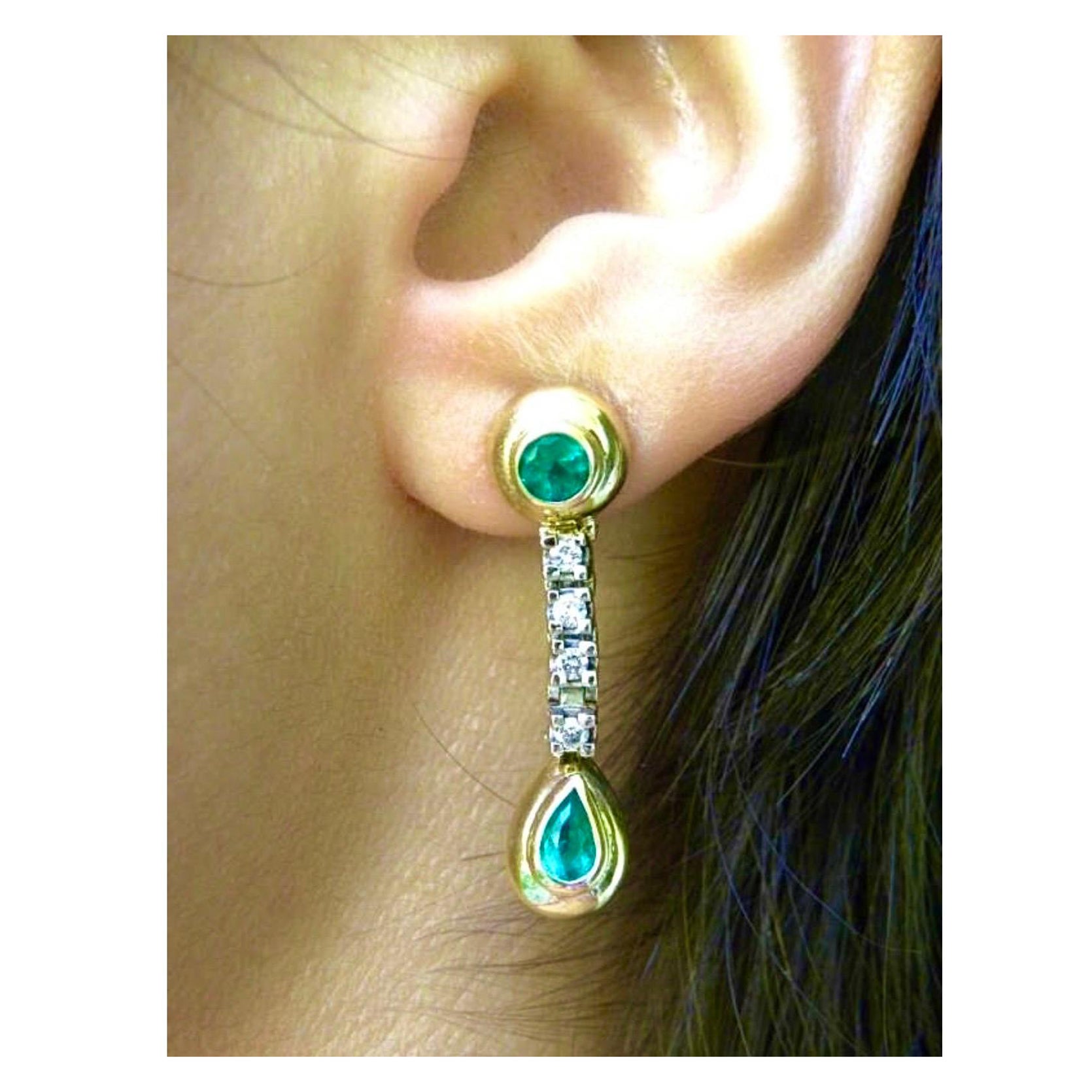 The Gorgeous two-tone gold Earrings
Feature 4 (2- round/2-pear shape)
Genuine and natural AAA Colombian emeralds 
that have an Intense Medium Green Color- VS. They are very Shimmering and clean. The 4 emeralds are bezel set in yellow gold 18K and 8