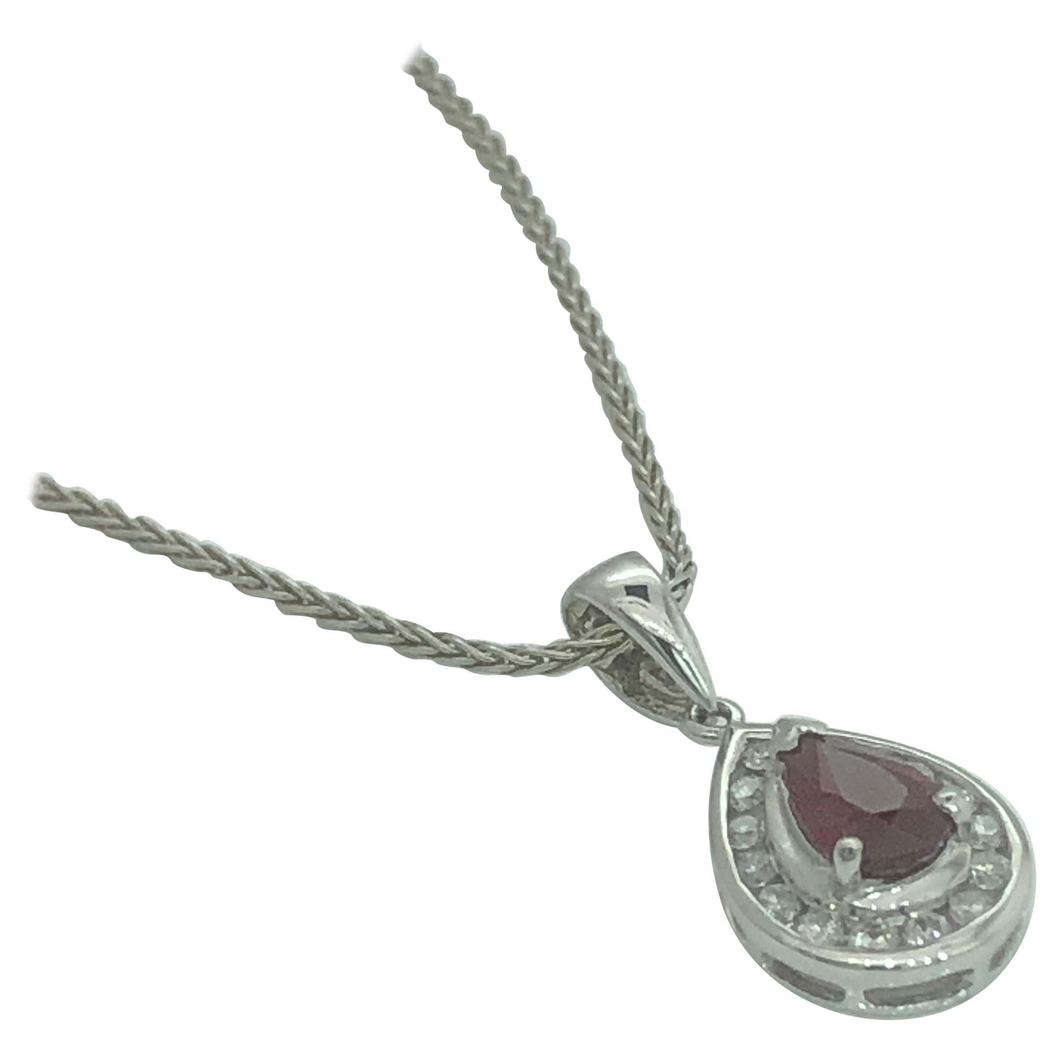 White gold teardrop pendant set with pear shape natural ruby and  diamonds For Sale