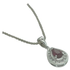 White gold teardrop pendant set with pear shape natural ruby and  diamonds